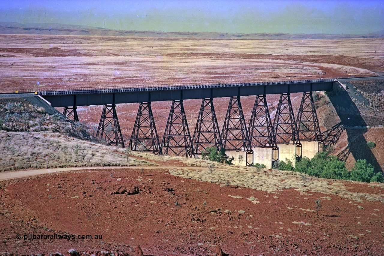 255-02
Fortescue River bridge on the Robe River Cape Lambert to Deepdale line at the 115.8 km looking south. Geodata [url=https://goo.gl/maps/FESXZ7bkPCQmeWhZ8]location here[/url]. May 2002.
