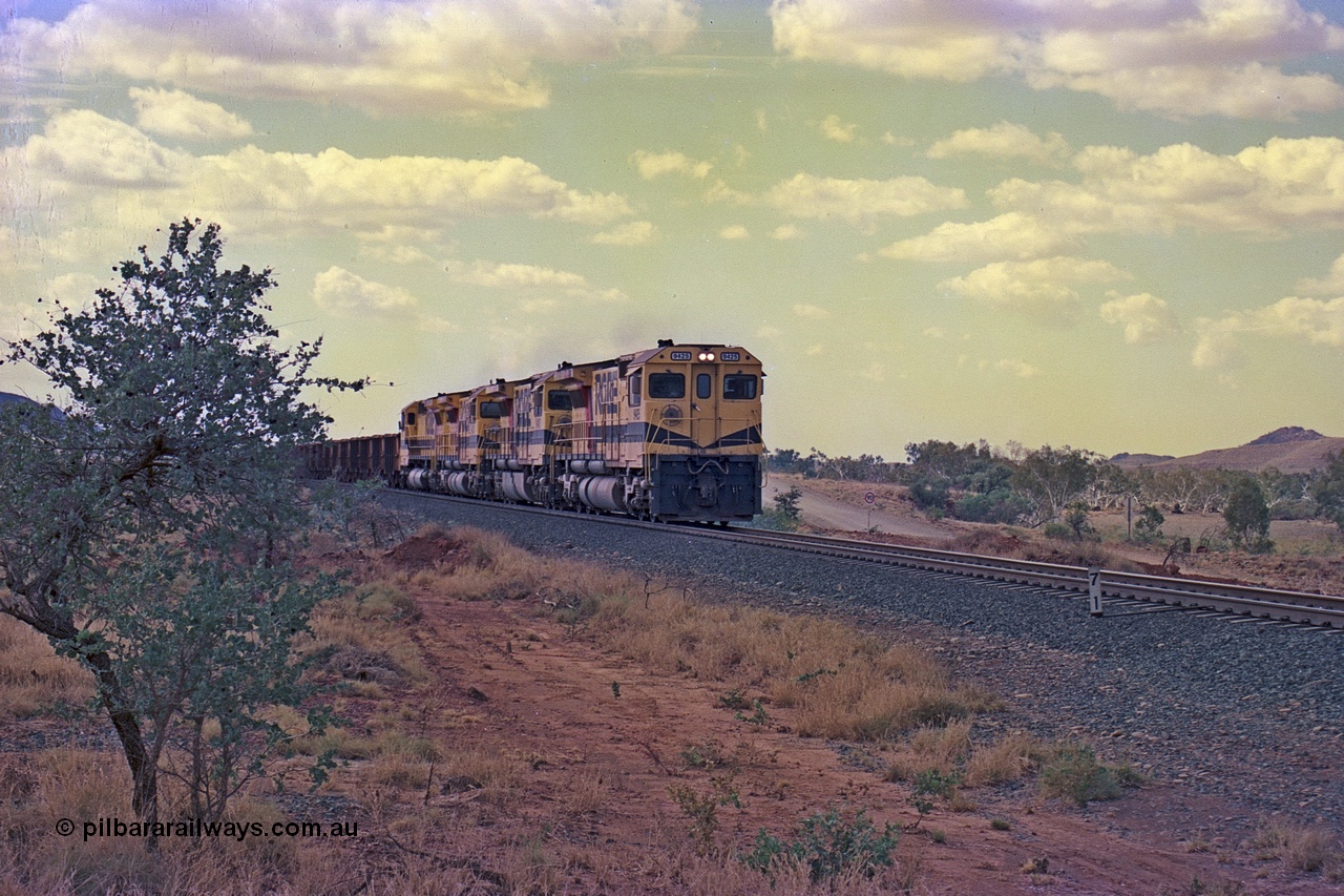 255-26
Western Creek at the 71 km on the Cape Lambert to Deepdale line an empty Robe River train powers upgrade as it heads to Mesa J for loading behind the standard quad CM40-8M lash up led by Goninan CM40-8M unit 9425 with serial number 6266-08 / 89-85 and sisters 9410, 9420 and 9414. Geodata [url=https://goo.gl/maps/fzacjsy5LHGwuSRg8]location here[/url]. May 2002.
Keywords: 9425;Goninan;GE;CM40-8M;6266-8/89-85;rebuild;AE-Goodwin;ALCo;M636;G-6041-4;