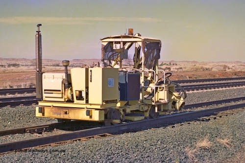 255-03
Siding Three back track, Fairmont Tamper sleeper inserter machine. May 2002.
