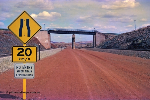 255-22
Western Creek, looking south alongside the Hamersley Iron Dampier to Tom Price line on the right with the new Robe River interconnecting line on the left as both lines pass under the Robe River Cape Lambert to Deepdale line bridge. Geodata [url=https://goo.gl/maps/ajP32PY1Zd11zPRx9]location here[/url]. May 2002.
