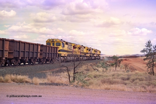 255-32
Western Creek at the 71 km on the Cape Lambert to Deepdale line an empty Robe River train powers upgrade behind the standard quad CM40-8M lash up led by Goninan CM40-8M unit 9425, 9410, 9420 and 9414 with serial number 8206-11 / 91-124. The Western Creek interconnecting line can be seen branching off to the right. Geodata [url=https://goo.gl/maps/fzacjsy5LHGwuSRg8]location here[/url]. May 2002.
Keywords: 9414;Goninan;GE;CM40-8M;8206-11/91-124;rebuild;AE-Goodwin;ALCo;M636;G6060-5;