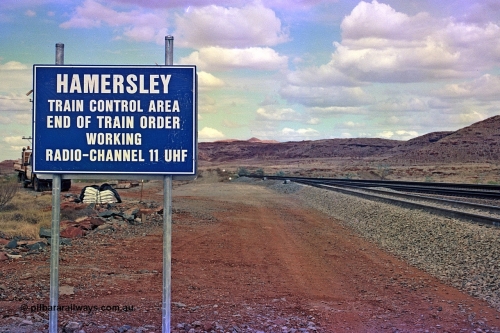 255-35
Emu Siding on the Hamersley Iron Dampier to Tom Price line with the Western Creek Robe River interconnecting line on the left joining the HI Tom Price line. Train Control board for crews to change channels. May 2002.
