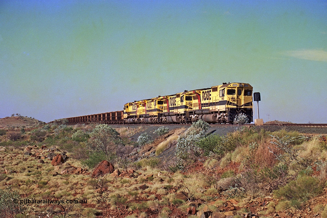 256-03
Maitland Siding on the Cape Lambert to Deepdale railway has a late afternoon empty train with the quad CM40-8M working of 9425, 9410, 9420 and 9414 in the siding waiting for a cross with an opposing loaded train. At the time of this image Siding 3 or Murray Camp was unable to cross ore trains so Siding One - Harding or Siding Two - Maitland were used. May 2002.
Keywords: 9425;Goninan;GE;CM40-8M;6266-8/89-85;rebuild;AE-Goodwin;ALCo;M636;G-6041-4;