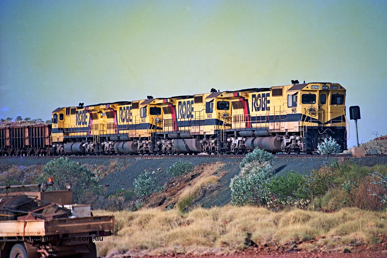 256-10
Maitland Siding on the Cape Lambert to Deepdale railway has a late afternoon empty train with the quad CM40-8M working of 9425, 9410, 9420 and 9414 in the siding waiting for a cross with an opposing loaded train. At the time of this image Siding 3 or Murray Camp was unable to cross ore trains so Siding One - Harding or Siding Two - Maitland were used. May 2002.
Keywords: 9425;Goninan;GE;CM40-8M;6266-8/89-85;rebuild;AE-Goodwin;ALCo;M636;G-6041-4;