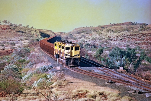 256-13
Maitland Siding on the Cape Lambert to Deepdale railway has a late afternoon empty train with the quad CM40-8M working of 9425, 9410, 9420 and 9414 in the siding waiting for a cross with an opposing loaded train. At the time of this image Siding 3 or Murray Camp was unable to cross ore trains so Siding One - Harding or Siding Two - Maitland were used. May 2002.
Keywords: 9425;Goninan;GE;CM40-8M;6266-8/89-85;rebuild;AE-Goodwin;ALCo;M636;G-6041-4;