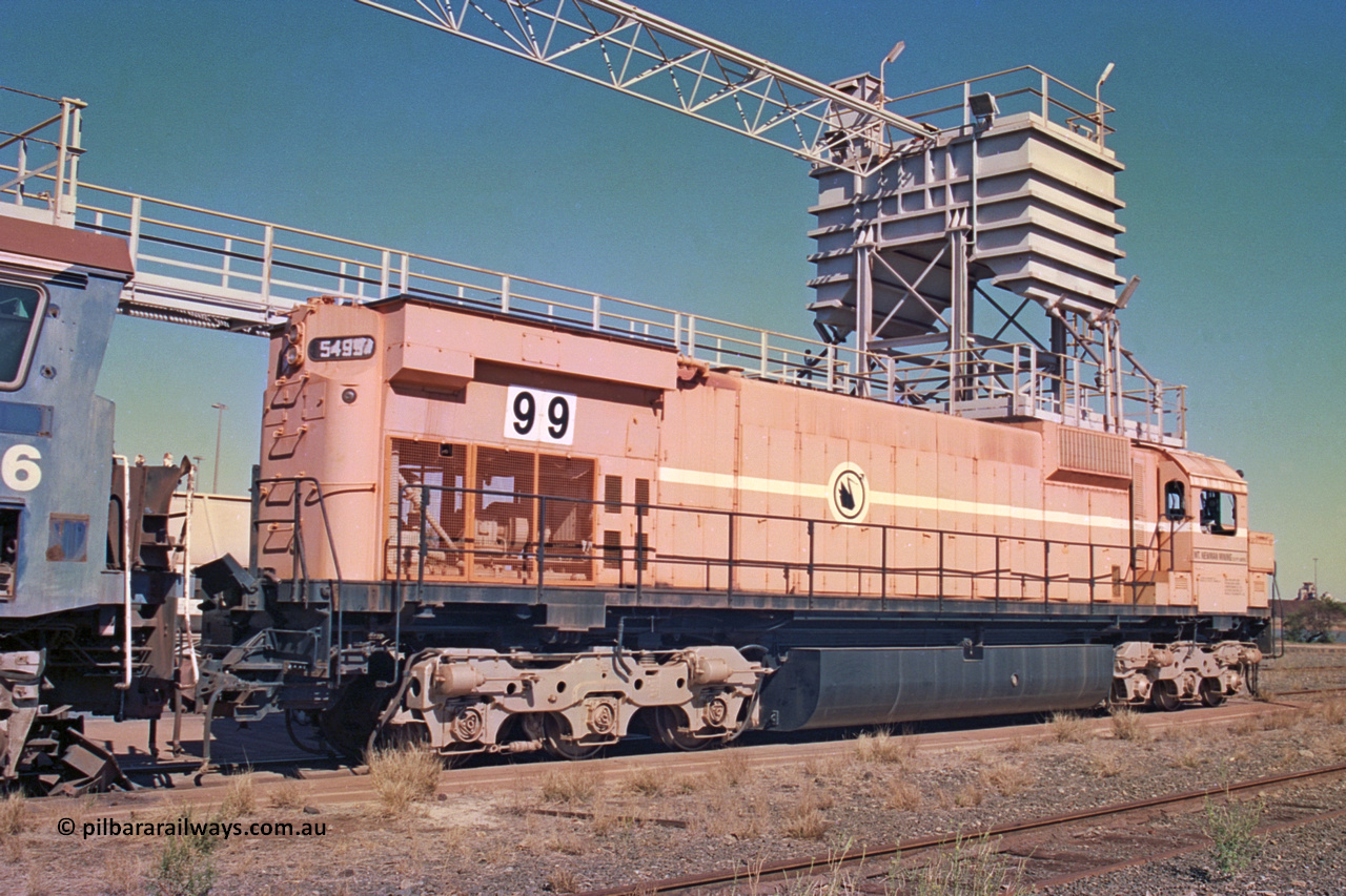 258-19
Nelson Point, old Loco Prep, Mt Newman Mining's last in-service ALCo M636 unit 5499 serial C6096-4 built by Comeng NSW sits awaiting partial dismantling before being sent by road to Rail Heritage WA's museum at Bassendean, Perth for preservation. May 2002.
Keywords: 5499;Comeng-NSW;ALCo;M636;C6096-4;