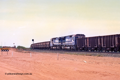 267-10
Goldsworthy Junction, BHP's 1230 empty departure mid-train units Goninan rebuild CM40-8M GE units 5651 'Tobata' serial number 8412-08 / 93-142 and 5645 'Sherlock' serial number 8281-11 / 92-134 104 waggons from the lead with 104 waggons trailing. The line curving away to the left is the Goldsworthy line to Boodarie and Finucane Island. 1247 hrs Friday 12th of April 2002.
Keywords: 5651;Goninan;GE;CM40-8M;8412-08/93-142;rebuild;AE-Goodwin;ALCo;M636C;5472;G6047-4;