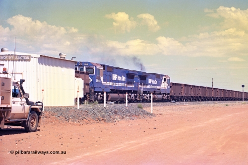 267-14
Goldsworthy Junction, BHP's 1230 empty departure trailing mid-train units Goninan rebuild CM40-8M GE units 5645 'Sherlock' serial number 8281-11 / 92-134 and lead remote 5651 power up at 104 waggons from the lead and passing the Goldsworthy Junction relay room. 1247 hrs Friday 12th of April 2002.
Keywords: 5645;Goninan;GE;CM40-8M;8281-11/92-134;rebuild;AE-Goodwin;ALCo;M636C;5475;G6047-7;