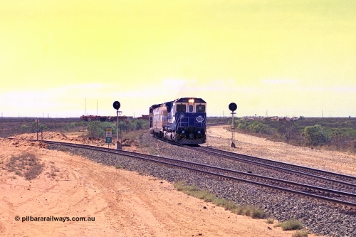 267-17
Goldsworthy Junction, the Sundowner Special is on the Newman mainline leg of the Goldsworthy Junction and triangle, with the Sundowner coach in between CM40-8M GE unit 5634 'Boodarie' serial number 8151-07 / 91-120 and sister CM40-8M 5653. This train, and the empty before it, were delayed due to a jamming switch for the transfer road where Tamper 2 and Ballast Regulator 31 can be seen holding track. The road curving around to the left is the Goldsworthy mainline to Boodarie and Finucane Island. Friday 12th of April 2002.
Keywords: 5634;Goninan;GE;CM40-8M;8151-07/91-120;rebuild;AE-Goodwin;ALCo;C636;5457;G6027-1;