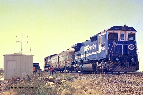 267-37
At the 39 km detection site with the Alstom 25-year service agreement special, BHP Iron Ore's Goninan GE rebuild CM40-8M unit 5634 'Boodarie' serial number 8151-07 / 91-120 stands on the Newman mainline with the train as the party alight for an inspection of the site.Friday 12th of April 2002.
Keywords: 5634;Goninan;GE;CM40-8M;8151-07/91-120;rebuild;AE-Goodwin;ALCo;C636;5457;G6027-1;