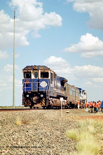 269-04
At the 39 km detection site with the Alstom 25-year service agreement special, BHP Iron Ore's Goninan GE rebuild CM40-8M unit 5653 'Chiba' serial number 8412-10 / 93-144 stands on the Newman mainline with The Sundowner and 5634 on the rear of the train as the party conducts an inspection of the site. Friday 12th of April 2002.
Keywords: 5653;Goninan;GE;CM40-8M;8412-10/93-144;rebuild;AE-Goodwin;ALCo;M636C;5484;G6061-5;