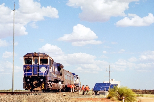 269-08
At the 39 km detection site with the Alstom 25-year service agreement special, BHP Iron Ore's Goninan GE rebuild CM40-8M unit 5653 'Chiba' serial number 8412-10 / 93-144 stands on the Newman mainline with The Sundowner and 5634 on the rear of the train as the party conducts an inspection of the site. Friday 12th of April 2002.
Keywords: 5653;Goninan;GE;CM40-8M;8412-10/93-144;rebuild;AE-Goodwin;ALCo;M636C;5484;G6061-5;