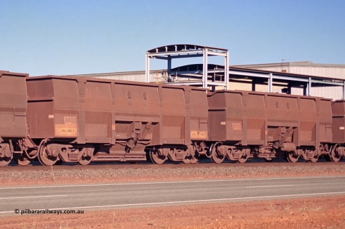 275-05
Boodarie, BHP Iron Ore's converted Golynx waggon to bottom discharge 8400, this was originally done by the ore car shop, with subsequent orders for similar bottom discharge waggons build by Goninan. 8411 is one such example and notice the subtle differences, the scalloped end, angle iron on the waggon top edge and the better clearance of the discharge doors. August 10, 2003.
Keywords: 8400;Goninan;Golynx;950088-176;BHP-Ore-Car-Shop;BHP/GML-ore-waggon;