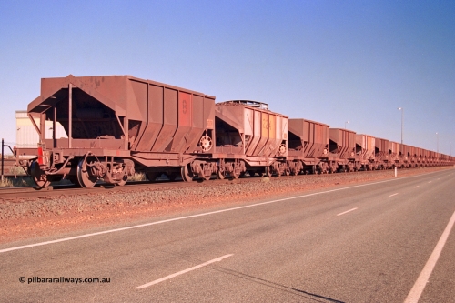 275-06
Boodarie, Tomlinson Steel built original Goldsworthy Mining ore waggon 8008, originally 8 on the rear of a loaded train as it heads to Finucane Island, August 10, 2003. Two hundred and thirty four of this style of ore waggon were built by Tomlinson Steel WA and Scotts of Ipswich, Qld between 1965 and 1972.
Keywords: 8008;Tomlinson-Steel;WA;BHP/GML-ore-waggon;