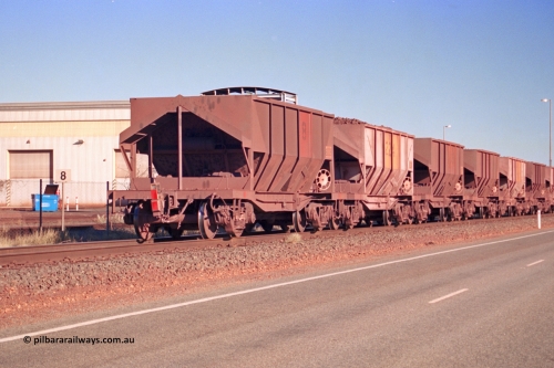 275-07
Boodarie, Tomlinson Steel built original Goldsworthy Mining ore waggon 8008, originally 8 on the rear of a loaded train as it heads to Finucane Island, August 10, 2003. Two hundred and thirty four of this style of ore waggon were built by Tomlinson Steel WA and Scotts of Ipswich, Qld between 1965 and 1972.
Keywords: 8008;Tomlinson-Steel;WA;BHP/GML-ore-waggon;