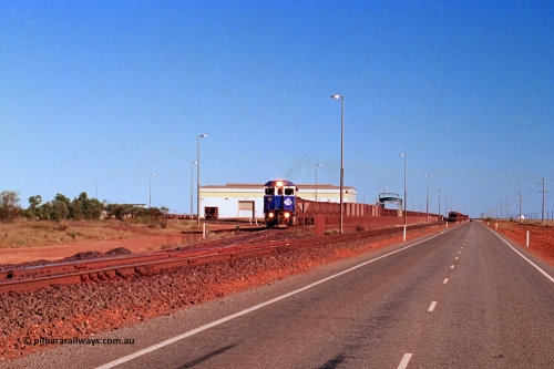 275-08
Boodarie, BHP Iron Ore's 5645 'Sherlock' departs the service road on its way to Yarrie with an empty. The loaded is running down the mainline towards Finucane Island. This scene has changed immensely since August 10, 2003.
Keywords: 5645;Goninan;GE;CM40-8M;8281-11/92-134;rebuild;AE-Goodwin;ALCo;M636C;5475;G6047-7;