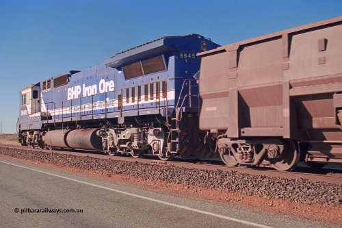 275-14
Boodarie, BHP Iron Ore's 5645 'Sherlock' an Goninan CM40-8M Alco to GE rebuild, departs the service road on its way to Yarrie with an empty, rear view of the Dash 8 radiator section or wings. August 10, 2003.
Keywords: 5645;Goninan;GE;CM40-8M;8281-11/92-134;rebuild;AE-Goodwin;ALCo;M636C;5475;G6047-7;