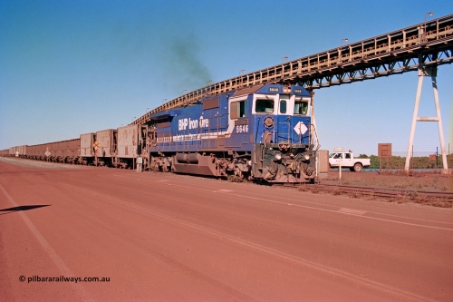 275-20
Finucane Island, BHP Iron Ore's CM40-8 locomotive 5646 'White Springs' arrives at the island across the -0.8 km grade crossing and the No. 6 switch where the balloon loops rejoins the mainline. The elevated conveyor is for the HBI plant. August 10, 2003.
Keywords: 5646;Goninan;GE;CM40-8;8244-11/92-135;