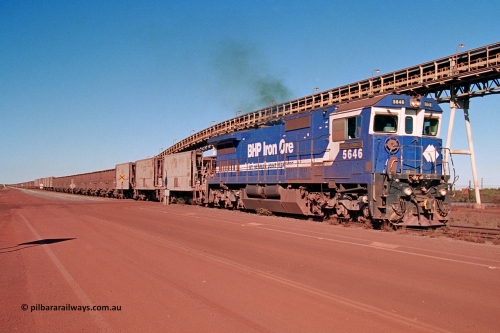 275-21
Finucane Island, BHP Iron Ore's CM40-8 locomotive 5646 'White Springs' arrives at the island across the -0.8 km grade crossing and the No. 6 switch where the balloon loops rejoins the mainline. The elevated conveyor is for the HBI plant. August 10, 2003.
Keywords: 5646;Goninan;GE;CM40-8;8244-11/92-135;