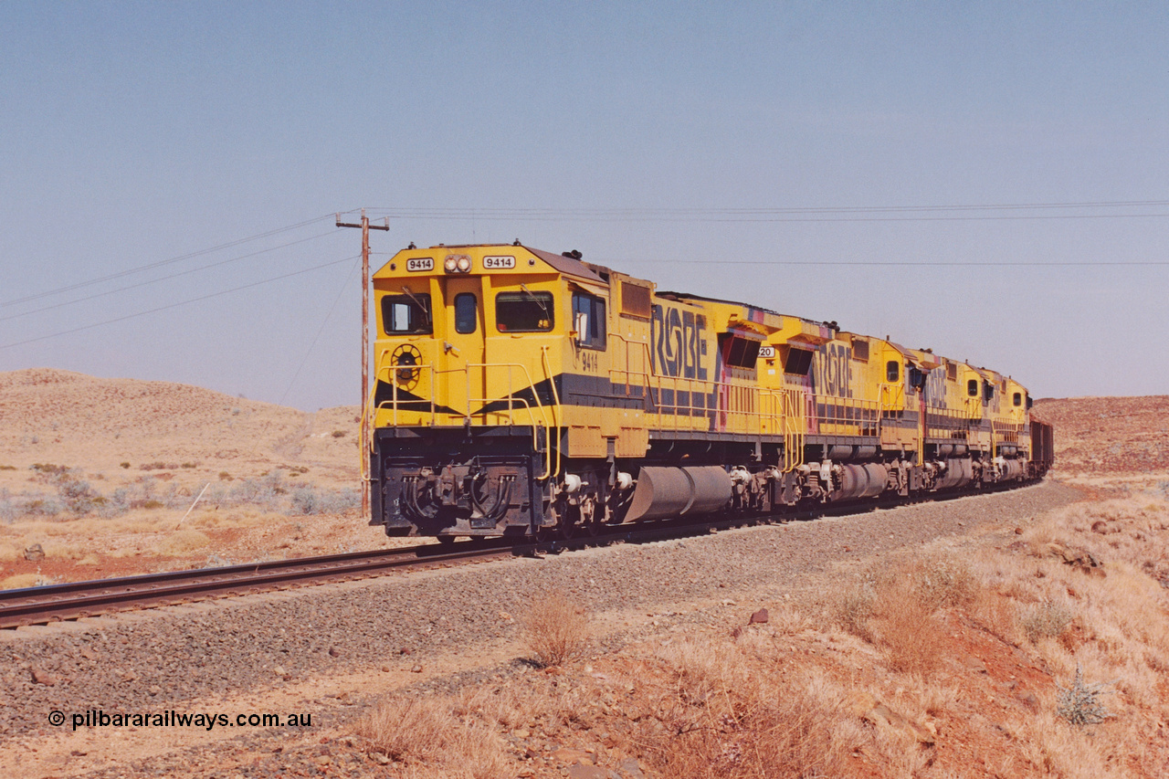 283-16
At the 45.4 km grade crossing on the Robe River line, loaded train easers around the curve behind the standard quad Goninan CM40-8M units led by 9414 serial number 8206-11 / 91-124 and rebuilt from the final of the original five ALCo units ordered from construction. 22nd of May 2002.
Keywords: 9414;Goninan;GE;CM40-8M;8206-11/91-124;rebuild;AE-Goodwin;ALCo;M636;G6060-5;