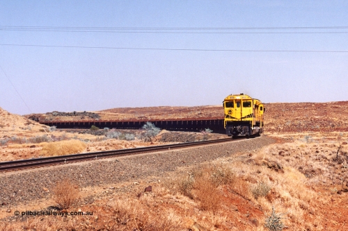 283-14
At the 45.4 km grade crossing on the Robe River line, loaded train easers around the curve behind the standard quad Goninan CM40-8M units led by 9414 serial number 8206-11 / 91-124 and rebuilt from the final of the original five ALCo units ordered from construction. 22nd of May 2002.
Keywords: 9414;Goninan;GE;CM40-8M;8206-11/91-124;rebuild;AE-Goodwin;ALCo;M636;G6060-5;