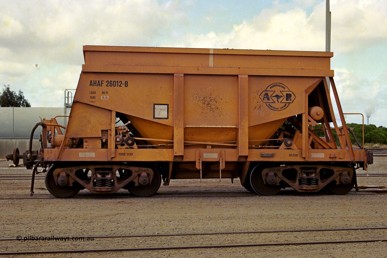 284-04
Narngulu, Geraldton, AHAF type iron ore waggon AHAF 26012 sits in the yard. One of twenty Kinki Sharyo Ltd of Japan built NHA type iron ore waggon for the North Australia line in 1968 that made it to WA under Aurizon for iron ore traffic on the narrow gauge. November 8, 2004.
Keywords: AHAF-type;AHAF26012;Kinki-Sharyo-Ltd-Japan;NHA-type;