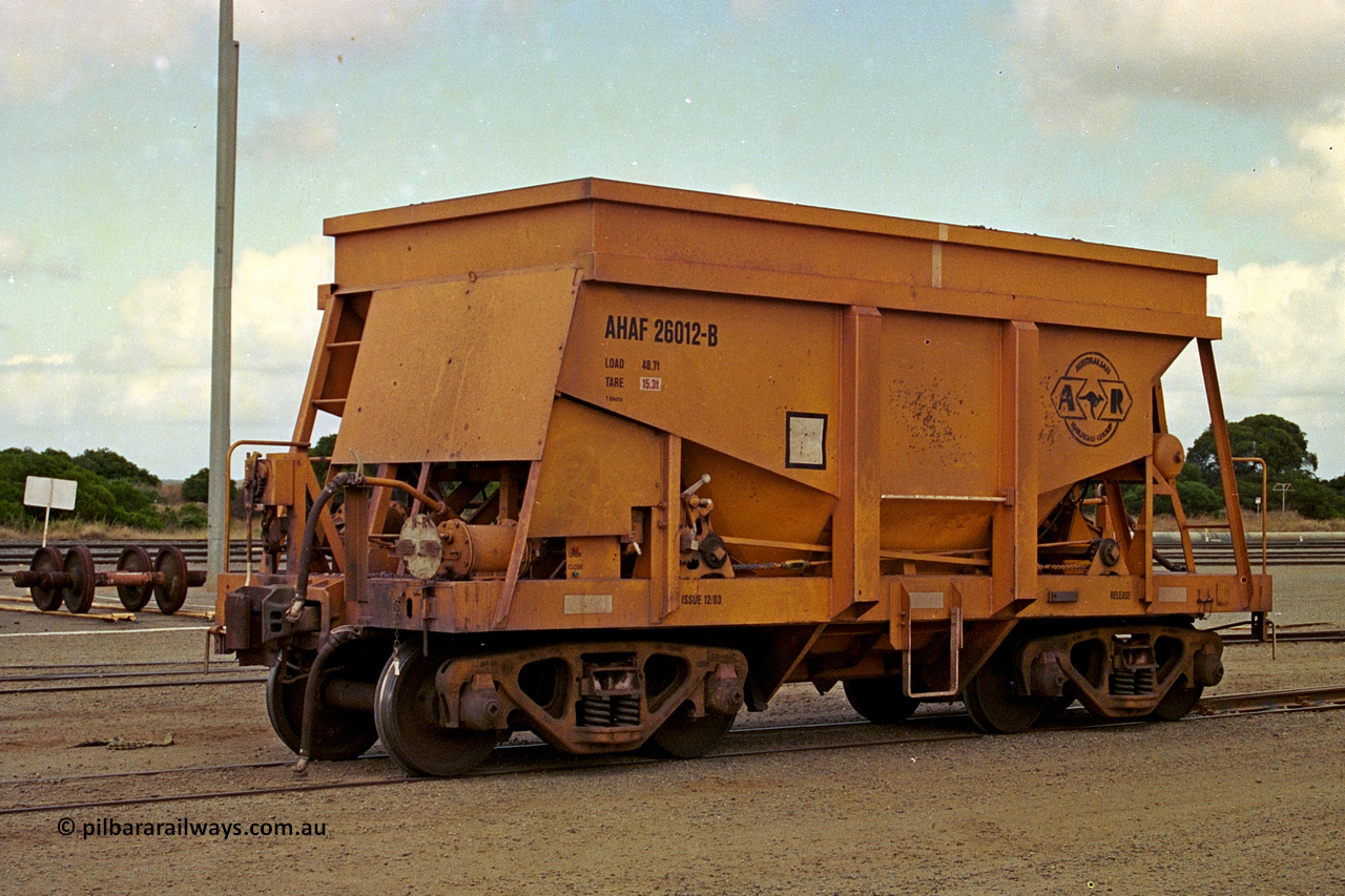 284-05
Narngulu, Geraldton, AHAF type iron ore waggon AHAF 26012 sits in the yard. One of twenty Kinki Sharyo Ltd of Japan built NHA type iron ore waggon for the North Australia line in 1968 that made it to WA under Aurizon for iron ore traffic on the narrow gauge. November 8, 2004.
Keywords: AHAF-type;AHAF26012;Kinki-Sharyo-Ltd-Japan;NHA-type;