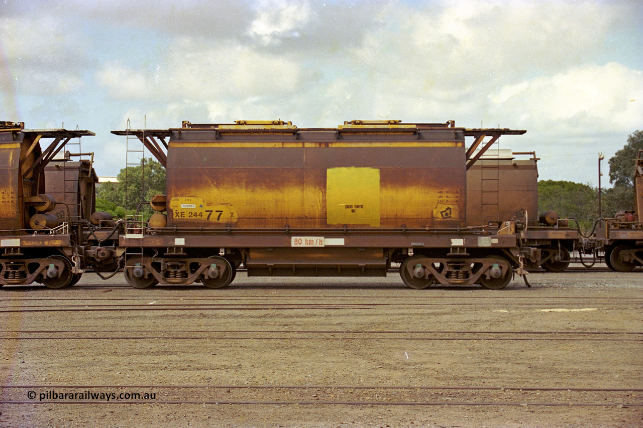 284-06
Narngulu yard, XE type hopper waggon XE 24477 built by Westrail Midland Workshops in 1976 as part of a batch of forty-one waggons for ilmenite cartage, seen here labelled for zircon traffic. November 8, 2004.
Keywords: XE-type;XE24477;Westrail-Midland-WS;