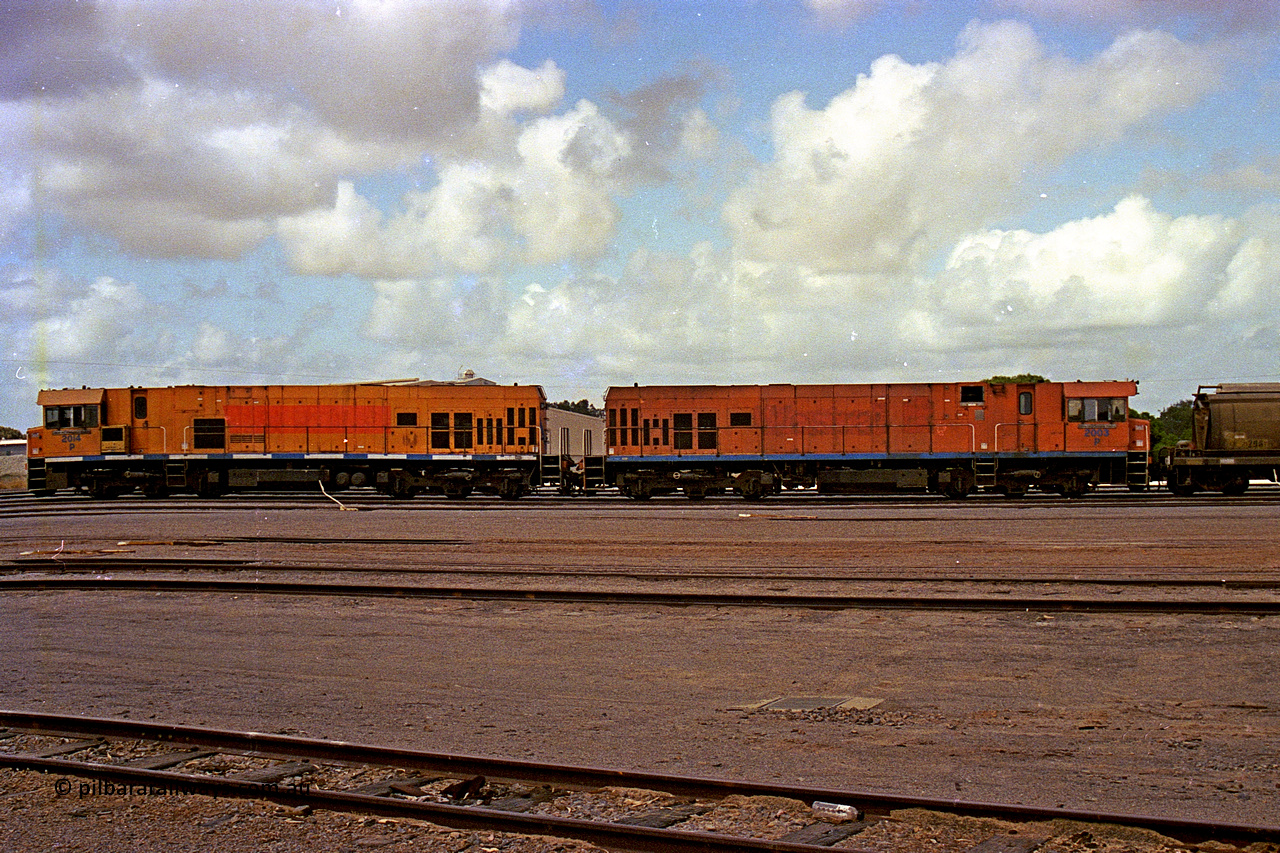 284-10
Narngulu, Geraldton, former Westrail P class loco P 2014 'Shire of Wongan-Ballidu' built by Goninan WA as a GE CM25-8 model with serial number 6320-12 / 90-099 sits in the yard on empty grain waggons with sister loco P 2003. November 9, 2004.
Keywords: P-class;P2014;Goninan-WA;GE;CM25-8;6320-12/90-099;