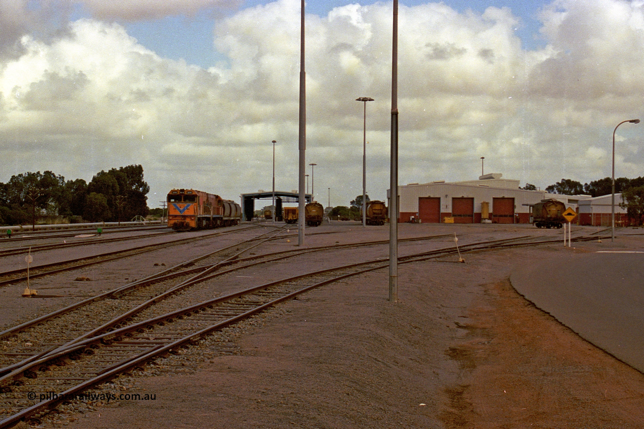 284-11
Narngulu yard [Geraldton] looking towards Geraldton, with the running shed in the middle distance and the workshop buildings on the right. November 9, 2004.
