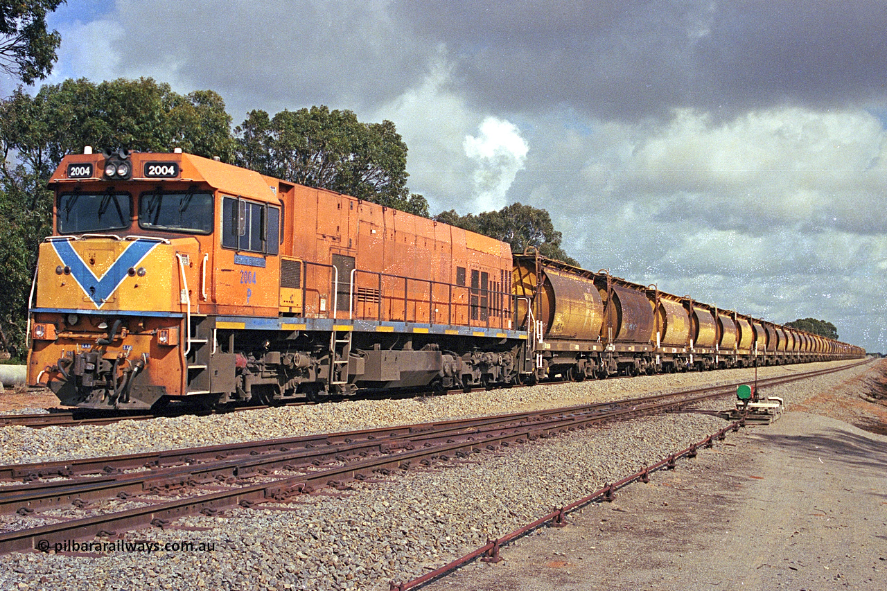 284-18
Narngulu, Geraldton, former Westrail P class loco P 2004 'Shire of Dalwallinu' built by Goninan WA as a GE CM25-8 model with serial number 6320-12 / 90-099 sits in the yard on empty mineral sand train waiting to run to Eneabba. November 9, 2004.
Keywords: P-class;P2004;Goninan-WA;GE;CM25-8;6320-03/90-089;