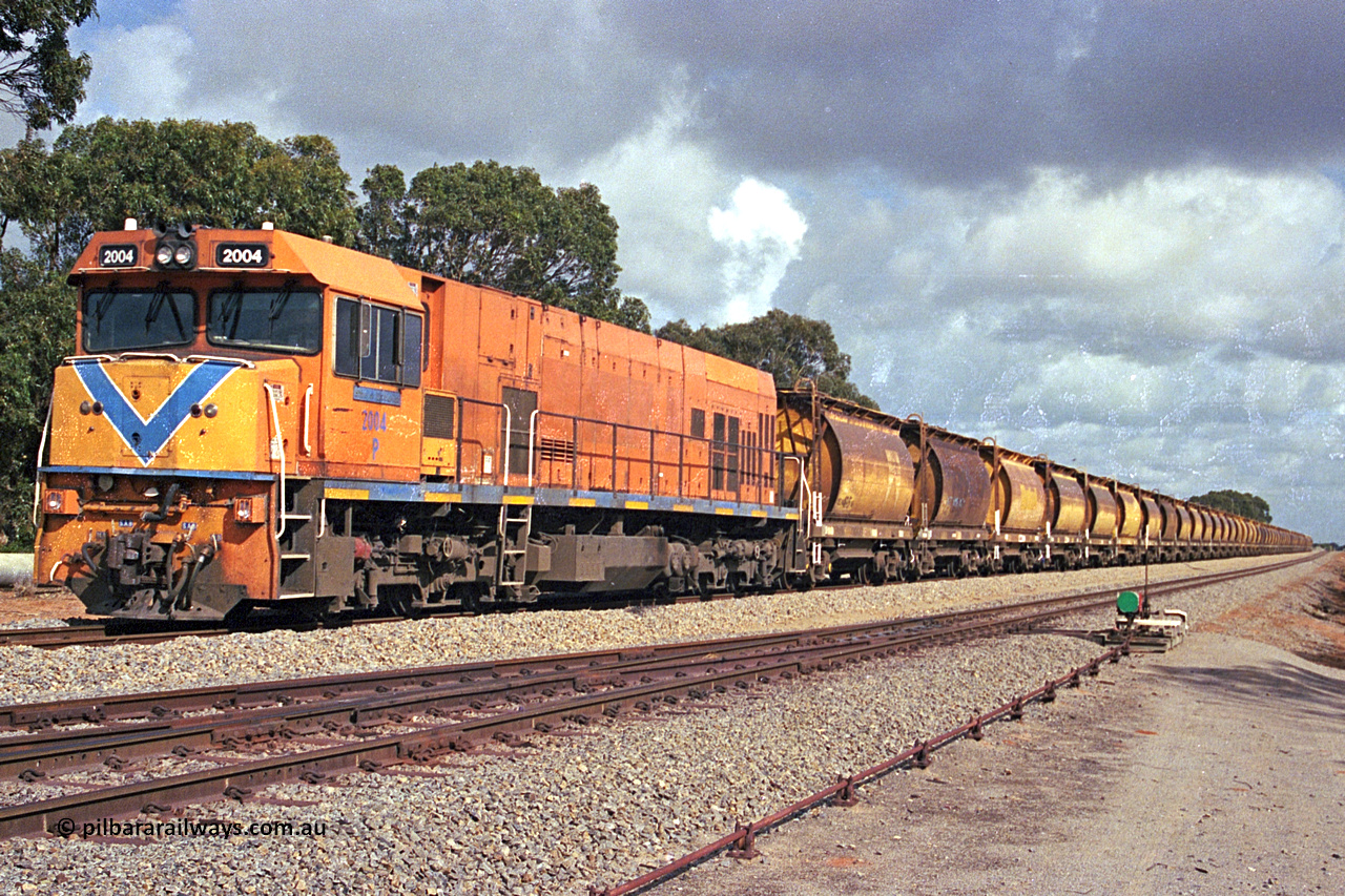 284-19
Narngulu, Geraldton, former Westrail P class loco P 2004 'Shire of Dalwallinu' built by Goninan WA as a GE CM25-8 model with serial number 6320-12 / 90-099 sits in the yard on empty mineral sand train waiting to run to Eneabba. November 9, 2004.
Keywords: P-class;P2004;Goninan-WA;GE;CM25-8;6320-03/90-089;