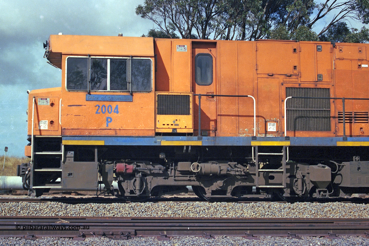 284-21
Narngulu, Geraldton, former Westrail P class loco P 2004 'Shire of Dalwallinu' built by Goninan WA as a GE CM25-8 model with serial number 6320-12 / 90-099 sits in the yard on empty mineral sand train waiting to run to Eneabba. November 9, 2004.
Keywords: P-class;P2004;Goninan-WA;GE;CM25-8;6320-03/90-089;