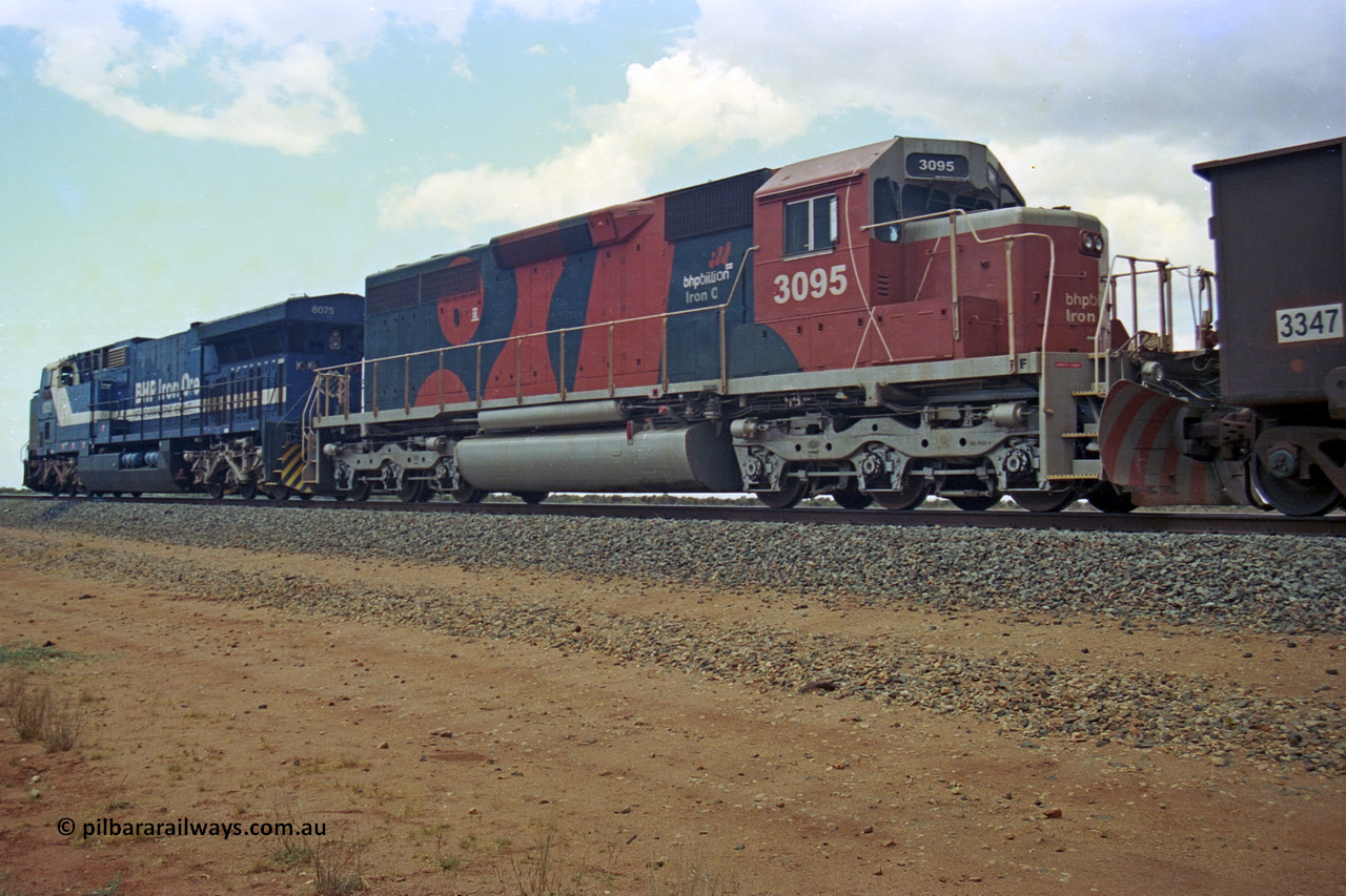 284-28
Bing Siding, 18 km south of Nelson Point with a loaded train holding the mainline with newly delivered BHP Billiton EMD SD40R unit 3095 serial 33677 as the second unit behind an AC6000. Late 2004.
Keywords: 3095;EMD;SD40R;33677/7083-7;SD40;SP8485;