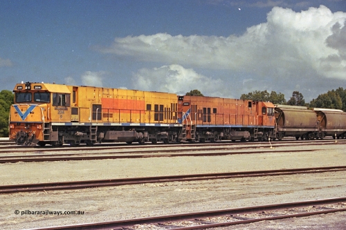 284-15
Narngulu, Geraldton, former Westrail P class loco P 2014 'Shire of Wongan-Ballidu' built by Goninan WA as a GE CM25-8 model with serial number 6320-12 / 90-099 sits in the yard on empty grain waggons with sister loco P 2003. November 9, 2004.
Keywords: P-class;P2014;Goninan-WA;GE;CM25-8;6320-12/90-099;