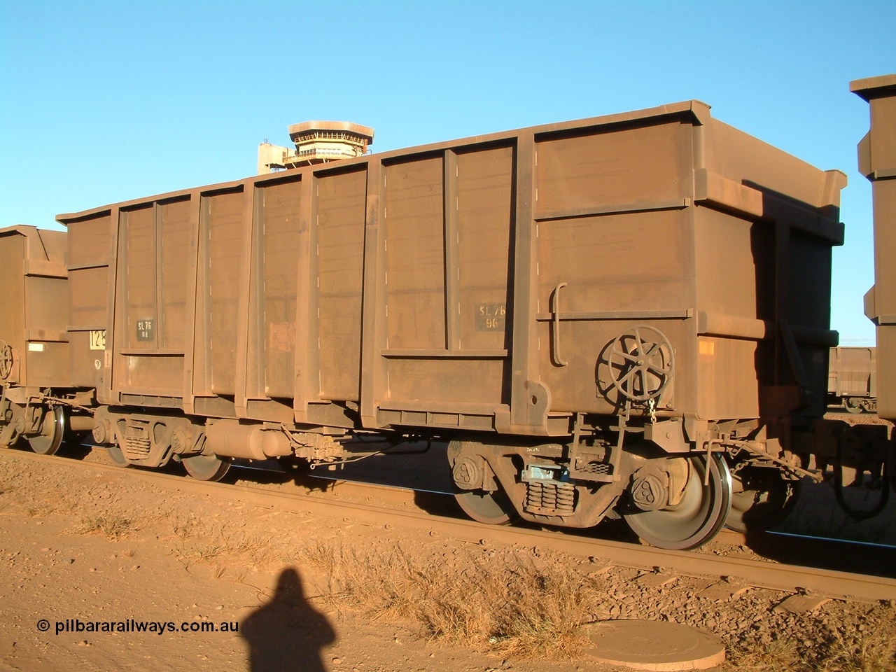040815 165746
Nelson Point Car Dumper 2, a waggon originally built by Comeng WA in 1973-74 and numbered 1283. But note the rounded bottom edge, this shows that it is a rebuilt ore waggon with 3CR12 stainless steel sides, while the ends, transoms and side ribs are the originals. These waggons were originally of a plain steel construction and were painted inside to prevent rust and wear. 15th August 2004.
Keywords: 1283;Comeng-WA;BHP-ore-waggon;
