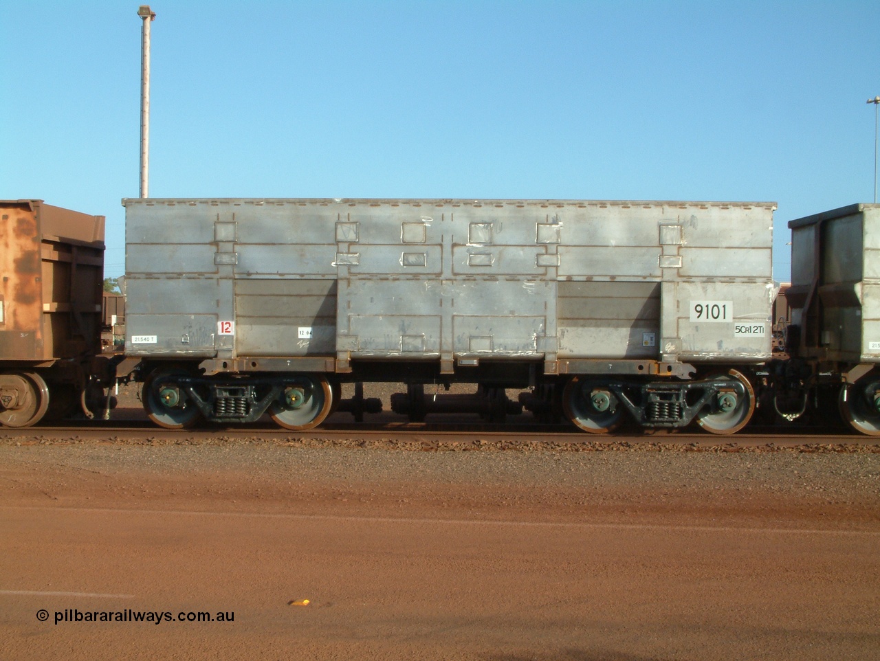 041225 064654
Nelson Point Ore Car Repair Shops, brand new Bradken NSW built ore waggon 9101 asset number 2031703. These waggons are the latest additions to the fleet with 20 on order in total. They are made from the same 5Cr12Ti steel that the Goninan Golynx waggons are made. 25th December 2004.
Keywords: 9101;Bradken-NSW;BHP-ore-waggon;