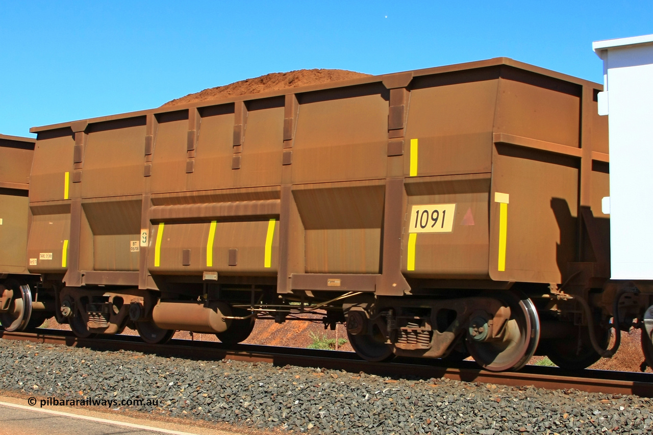 1091 UG 110414 0110
Boodarie, loaded BHP ore waggon 1091, a United Goninan replacement for an original Comeng numbered waggon. April 14, 2011.
Keywords: 1091;United-Goninan-WA;BHP-ore-waggon;