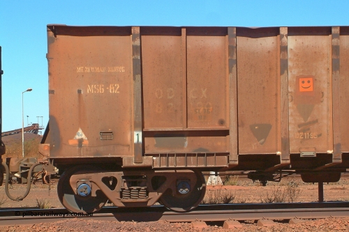 0553 Magor 030712 142552
Nelson Point, empty BHP ore waggon 553, one of the original Magor USA build waggons bought out at construction of the Mt Newman project. Visible is the ODCX code and number 82190 from the Oroville Dam Construction company days in the USA. Unsure of the MS6-82 code, the DZ 11-95 code was the late time it was internally painted to reduce wear and the SL 76 with 92 below it was the last time the Miner SL-76 draft gear was replaced. The orange smiley sticker indicates that this is an original 'Oroville Dam' ore waggon and non relayed AB braked. 12th of July 2003. 0 has been added to number to correctly place the waggon in sequence. July 12, 2003.
Keywords: 553;Magor-USA;BHP-ore-waggon;