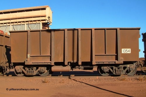 1354 Comeng 040804 155910
Nelson Point, empty BHP ore waggon 1354 is a Comeng WA build from a batch of two hundred and twenty-six in 1973/74. Side view of waggon with resheeted side walls. August 4, 2004.
Keywords: 1354;Comeng-WA;BHP-ore-waggon;