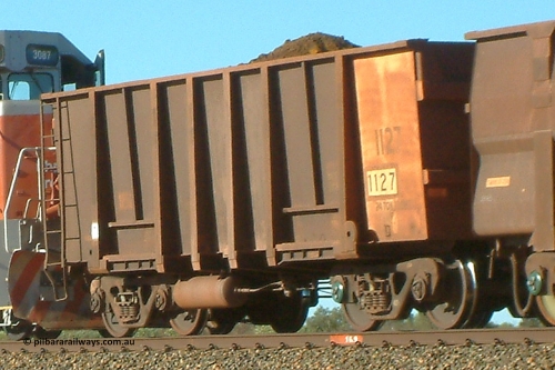 1127 Comeng 040802 155612
Bing, loaded BHP ore waggon 1127, one of a Comeng WA 1971 build of one hundred and eighty-three waggons. August 2, 2004.
Keywords: 1127;Comeng-WA;BHP-ore-waggon;