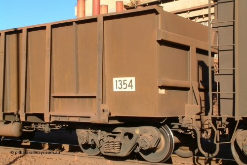 1354 Comeng 040804 155931
Nelson Point, empty BHP ore waggon 1354 is a Comeng WA build from a batch of two hundred and twenty-six in 1973/74. Waggon has been resheeted with new side walls, shows end profile with square edges. August 4, 2004.
Keywords: 1354;Comeng-WA;BHP-ore-waggon;
