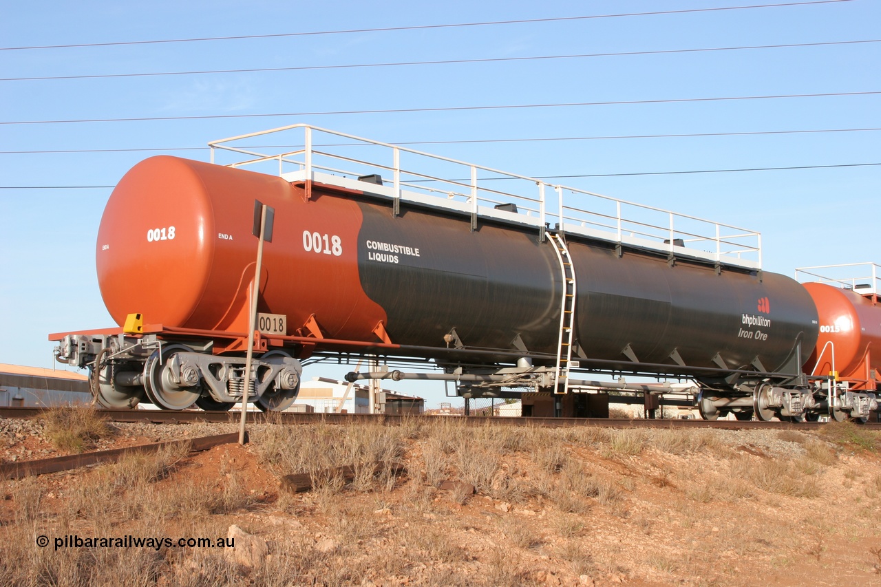 050410 0536
Nelson Point, tanker filling area, fuel tank waggon 0018, a Comeng WA built 114 kilolitre tank waggon, one of a batch of three built in 1974-75 wearing the newer corporate 'Earth' livery of BHP Billiton Iron Ore.
Keywords: Comeng-WA;BHP-tank-waggon;