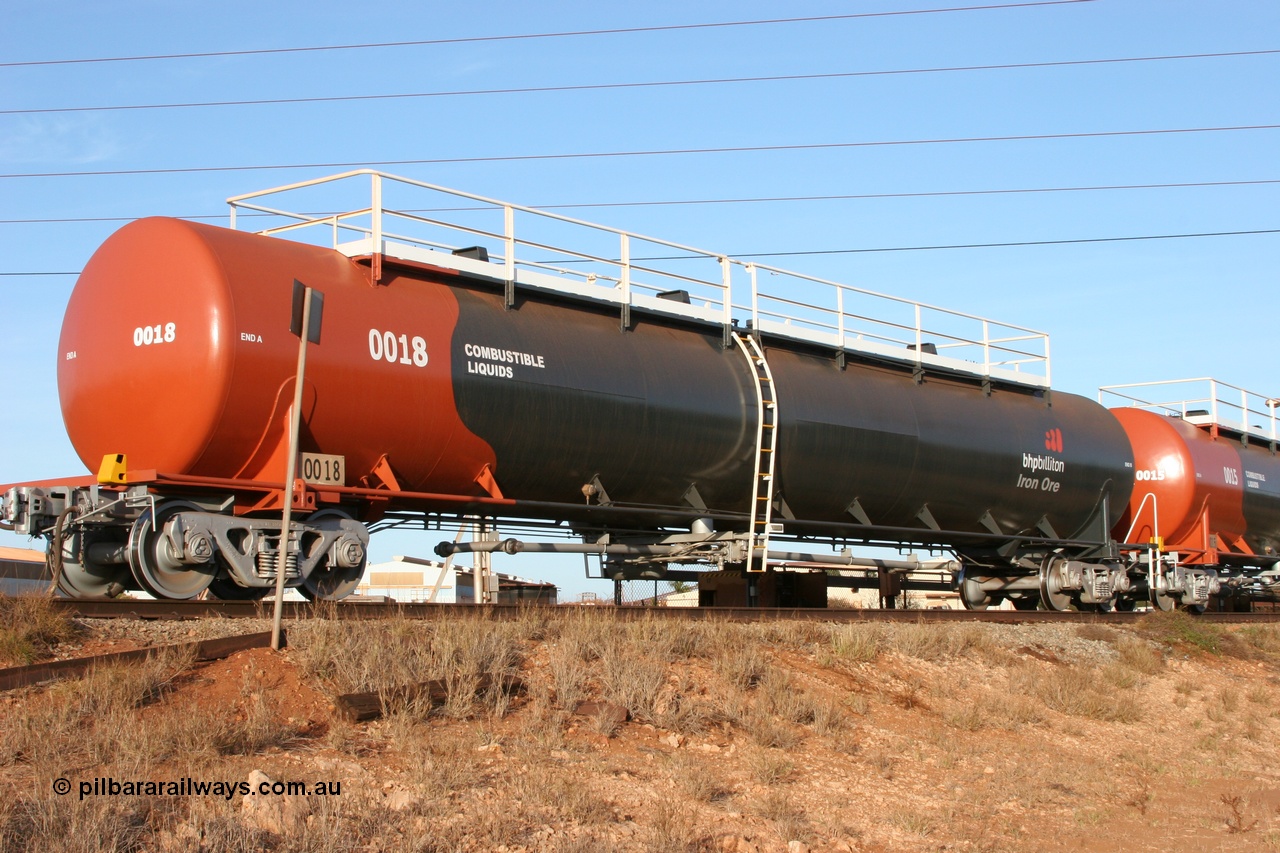 050410 0537
Nelson Point, tanker filling area, fuel tank waggon 0018, a Comeng WA built 114 kilolitre tank waggon, one of a batch of three built in 1974-75 wearing the newer corporate 'Earth' livery of BHP Billiton Iron Ore.
Keywords: Comeng-WA;BHP-tank-waggon;