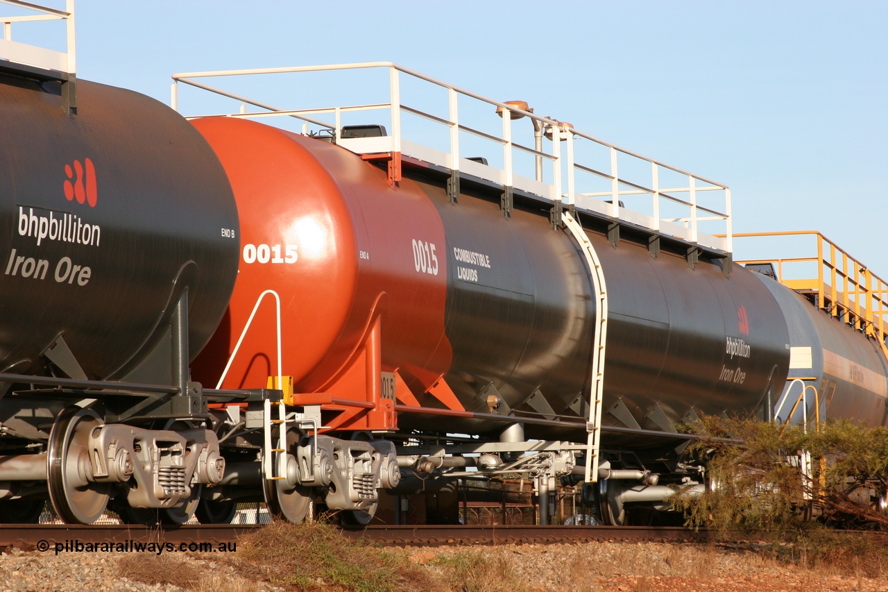 050410 0540
Nelson Point, tanker filling area, fuel tank waggon 0015, a Comeng NSW built 112 kilolitre tank waggon, one of a batch of four built in 1972 wearing the newer corporate 'Earth' livery of BHP Billiton Iron Ore.
Keywords: Comeng-WA;BHP-tank-waggon;