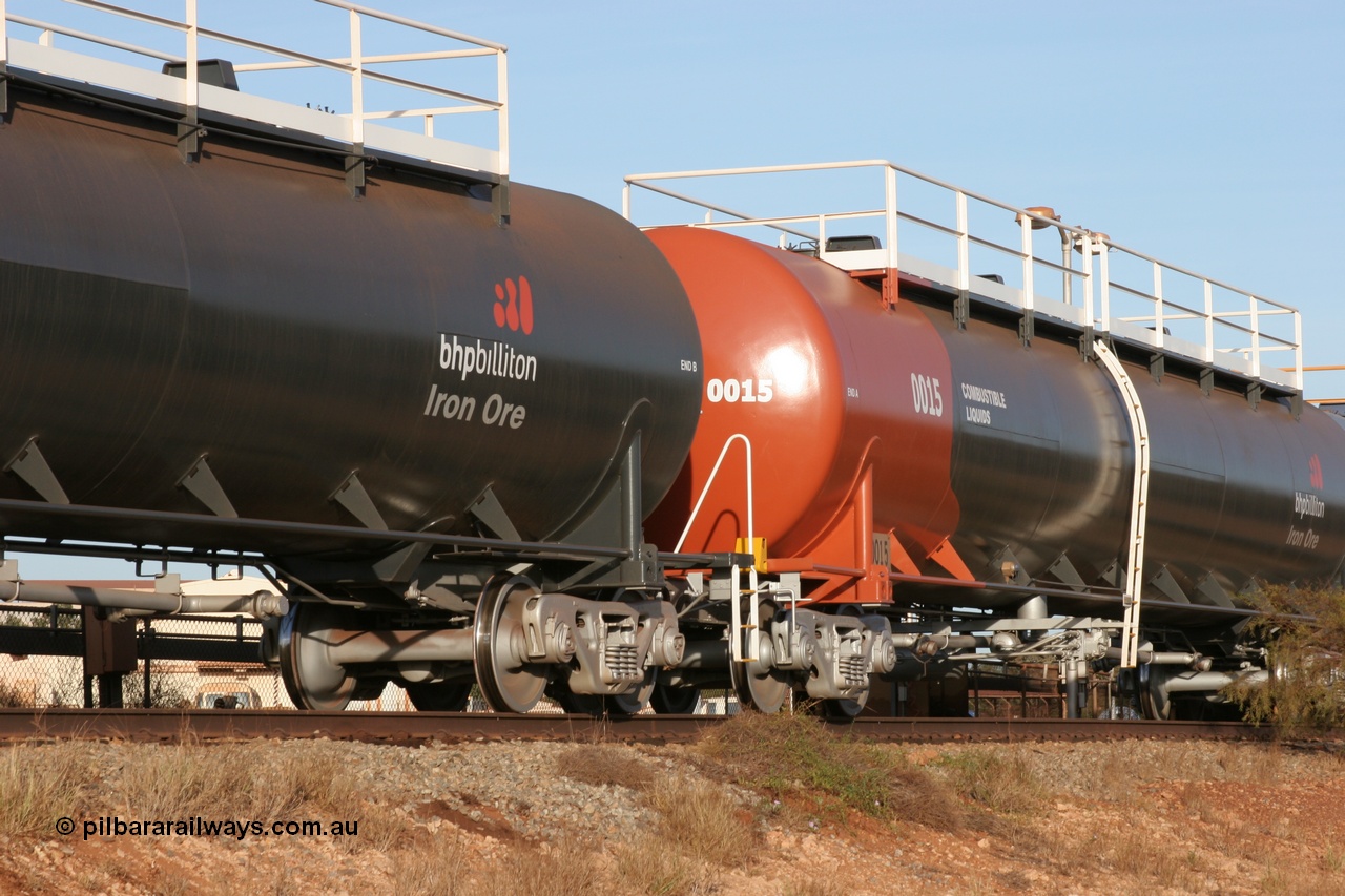 050410 0542
Nelson Point, tanker filling area, fuel tank waggon 0015, a Comeng NSW built 112 kilolitre tank waggon, one of a batch of four built in 1972 wearing the newer corporate 'Earth' livery of BHP Billiton Iron Ore.
Keywords: Comeng-WA;BHP-tank-waggon;
