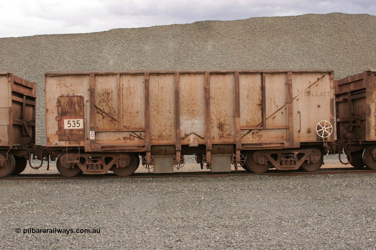 050412 0770
Quarry 8, Shaw Siding area. Side view of 1963 built Magor USA waggon 535, originally in ore service before conversion to a ballast waggon.
Keywords: Magor-USA;BHP-ballast-waggon;