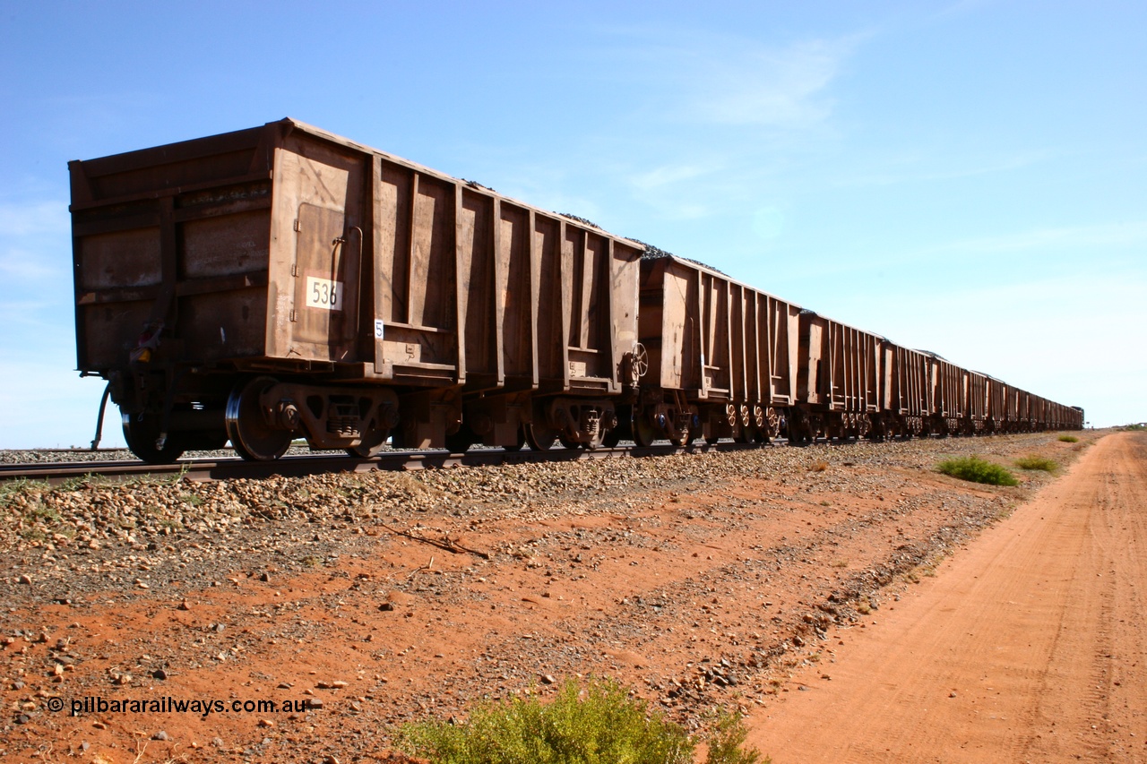050518 2200
Bing Siding. Rear 3/4 view of ballast train and of 1963 built Magor USA waggon 536, originally in ore service before conversion to a ballast waggon.
Keywords: Magor-USA;BHP-ballast-waggon;