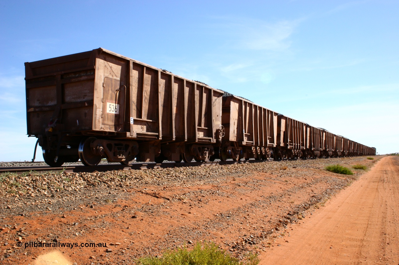 050518 2201
Bing Siding. Rear 3/4 view of ballast train and of 1963 built Magor USA waggon 536, originally in ore service before conversion to a ballast waggon.
Keywords: Magor-USA;BHP-ballast-waggon;