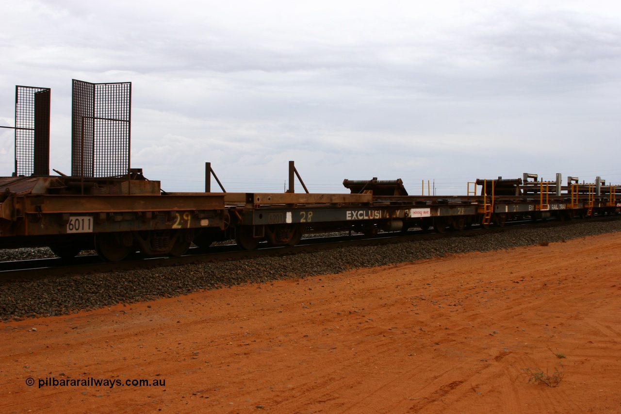 050522 2738
Goldsworthy Junction, rail recovery and transport train flat waggon #28, second lead in waggon 6201, built by Comeng WA in January 1977 under order number 07-M-282 RY, the mesh guarding is for the winch cable. The chute arrangement for the discharging and recovery of rail is visible.
Keywords: Comeng-WA;BHP-rail-train;